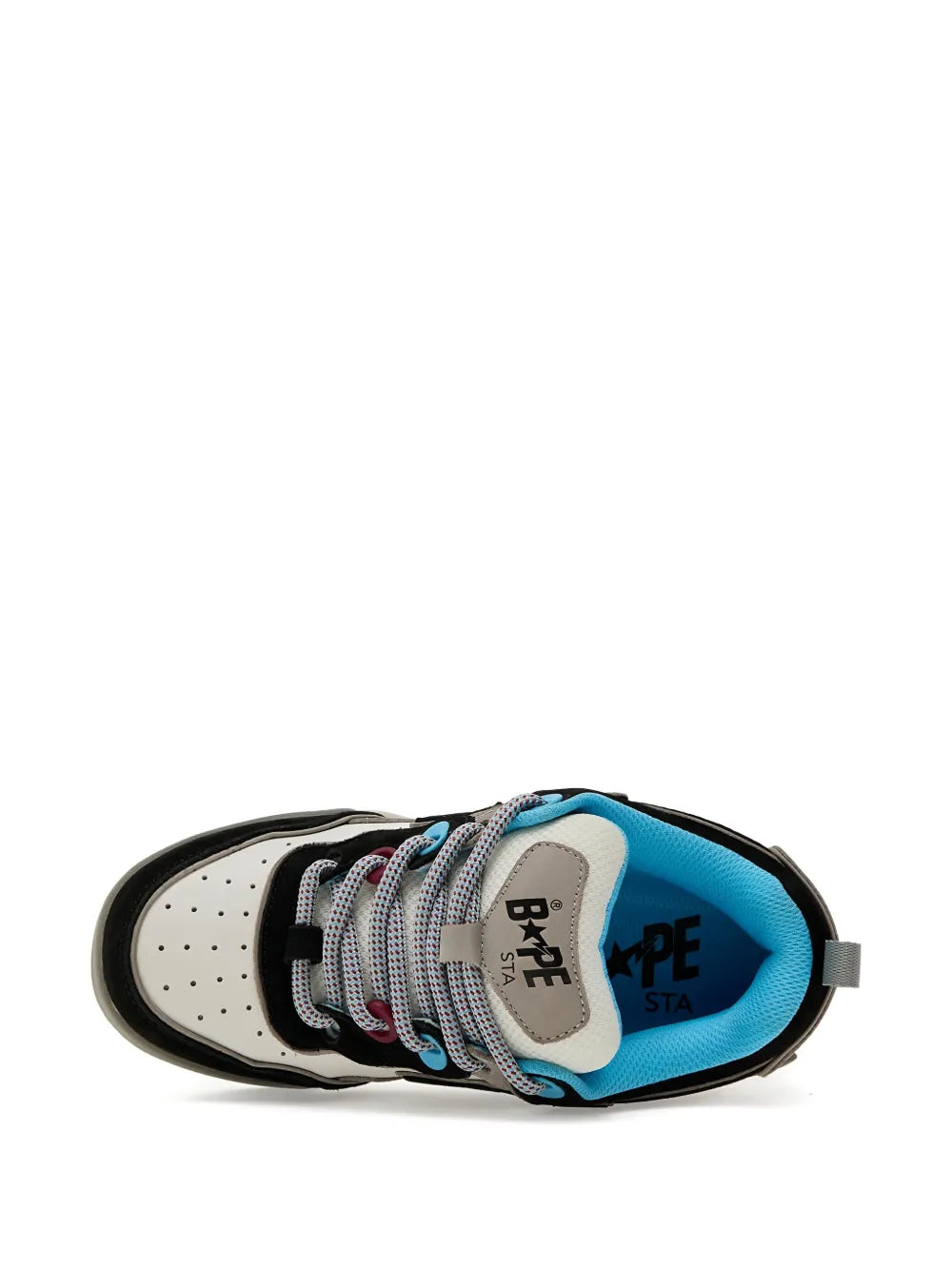 Low-top sneaker toe view with blue lining, patterned laces, and BAPE STA text on tongue