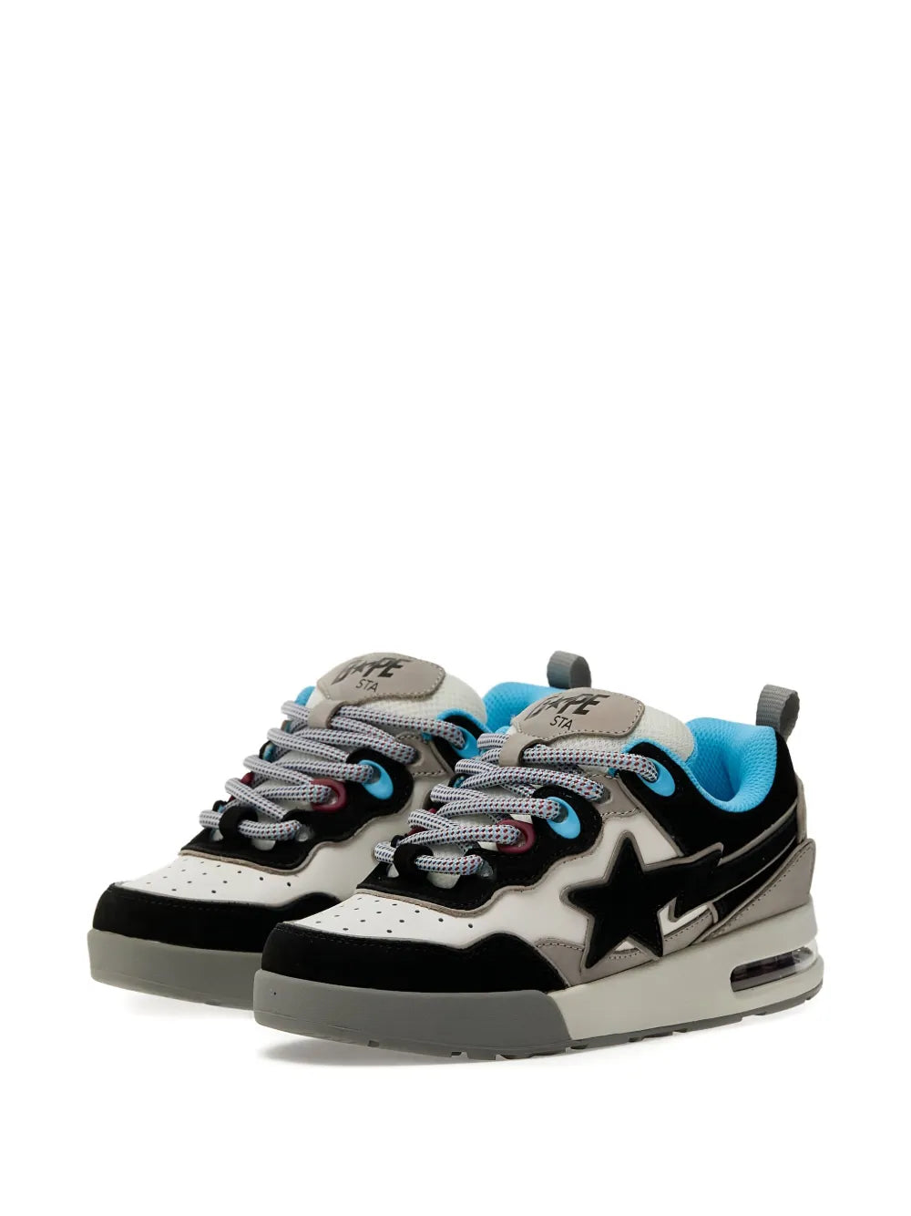 Pair of low-top lace-up sneakers with black star, gray uppers, and blue heel lining