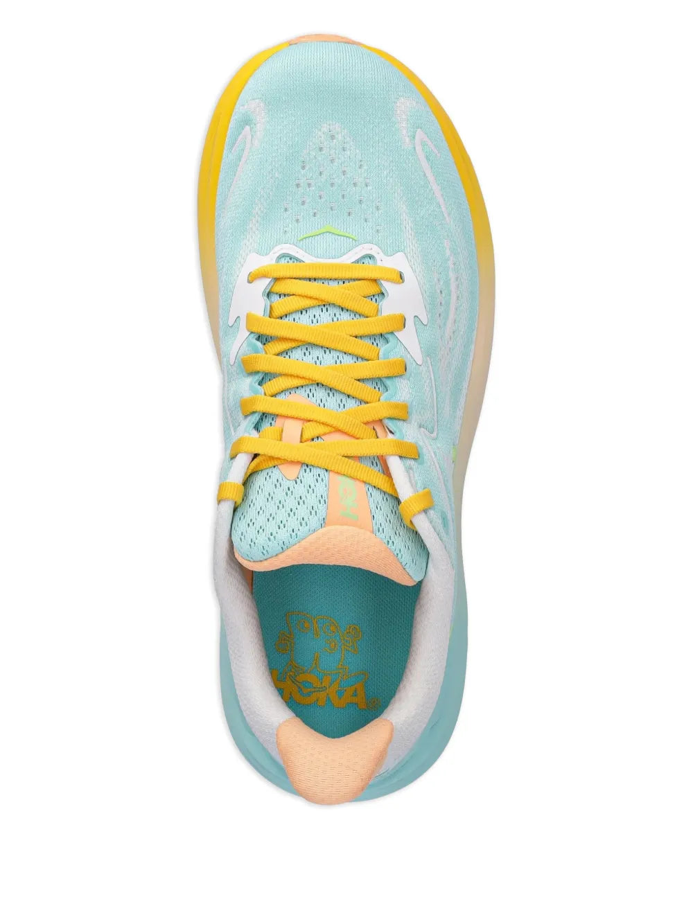 Light blue sneaker top view with yellow laces and cushioned tongue