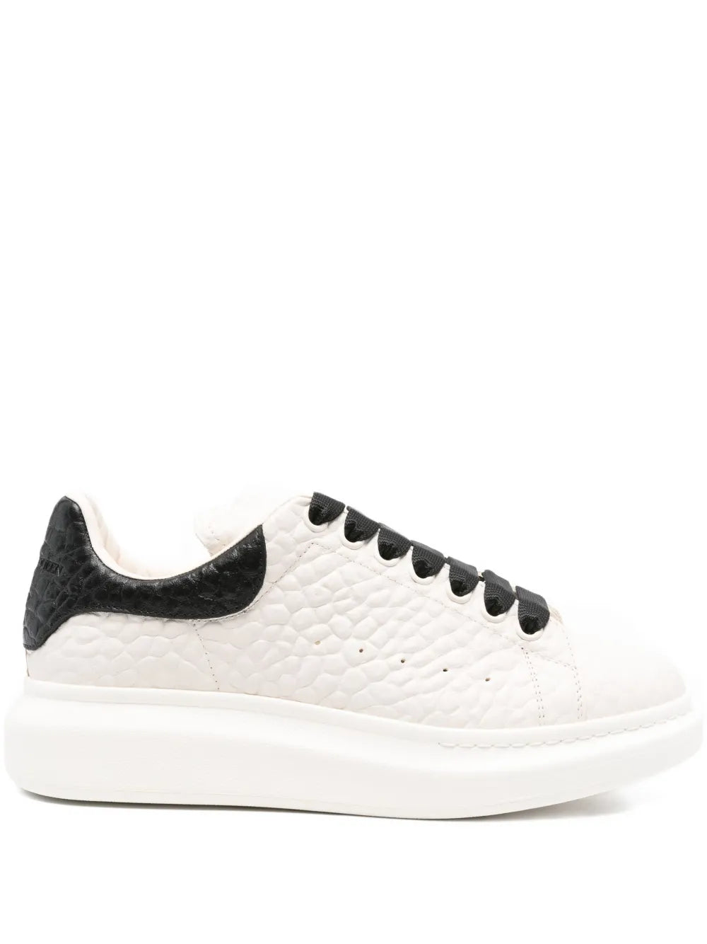 White textured leather sneaker with black side panel and thick white sole