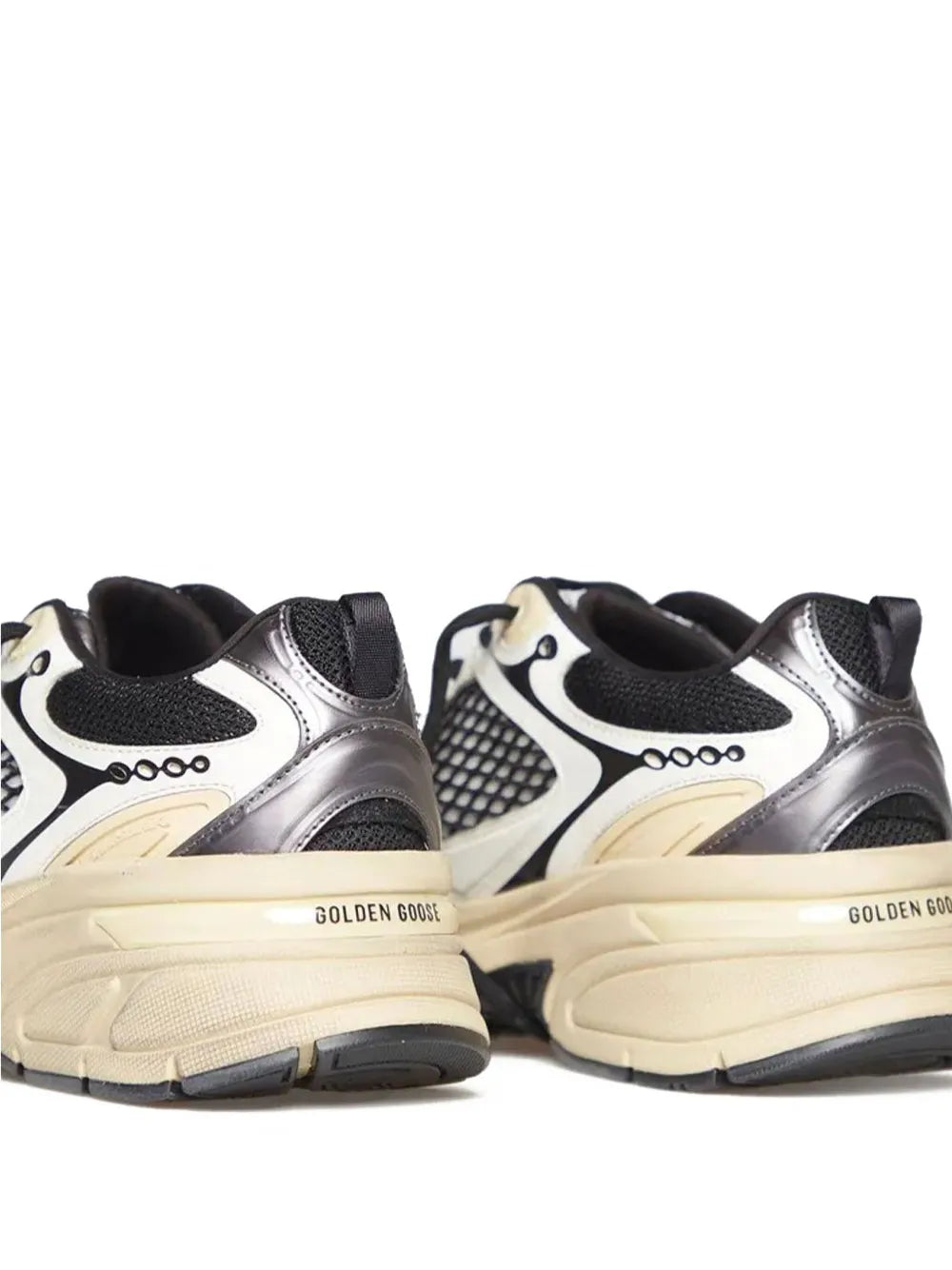 Golden Goose Lightstar sneakers pair, silver-toned uppers with black heel and mesh