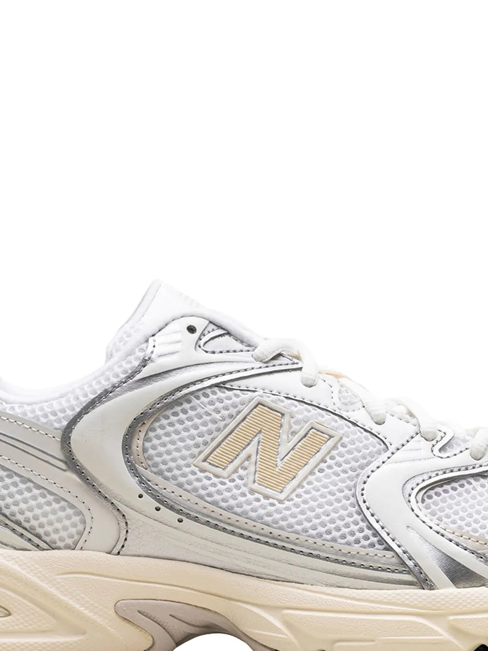 New Balance 530 trainers close-up, silver mesh upper, N logo, white laces