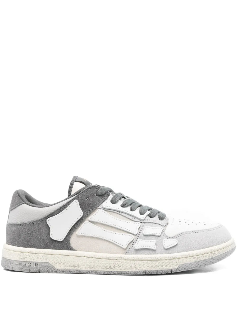 Grey and white low-top sneakers with bone-style paneling and lace-up front