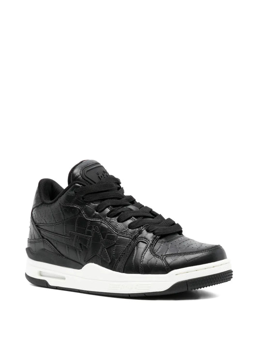 Black low-top sneakers side view, textured panels, black laces, white midsole