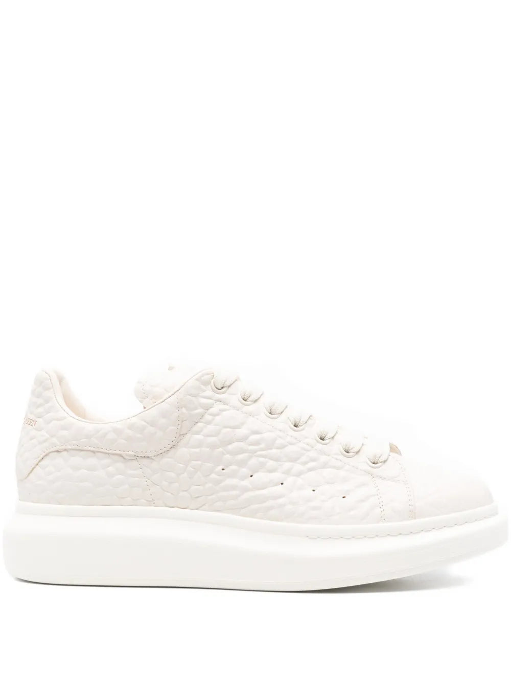 Off-white textured low-top lace-up sneakers with rubber platform sole