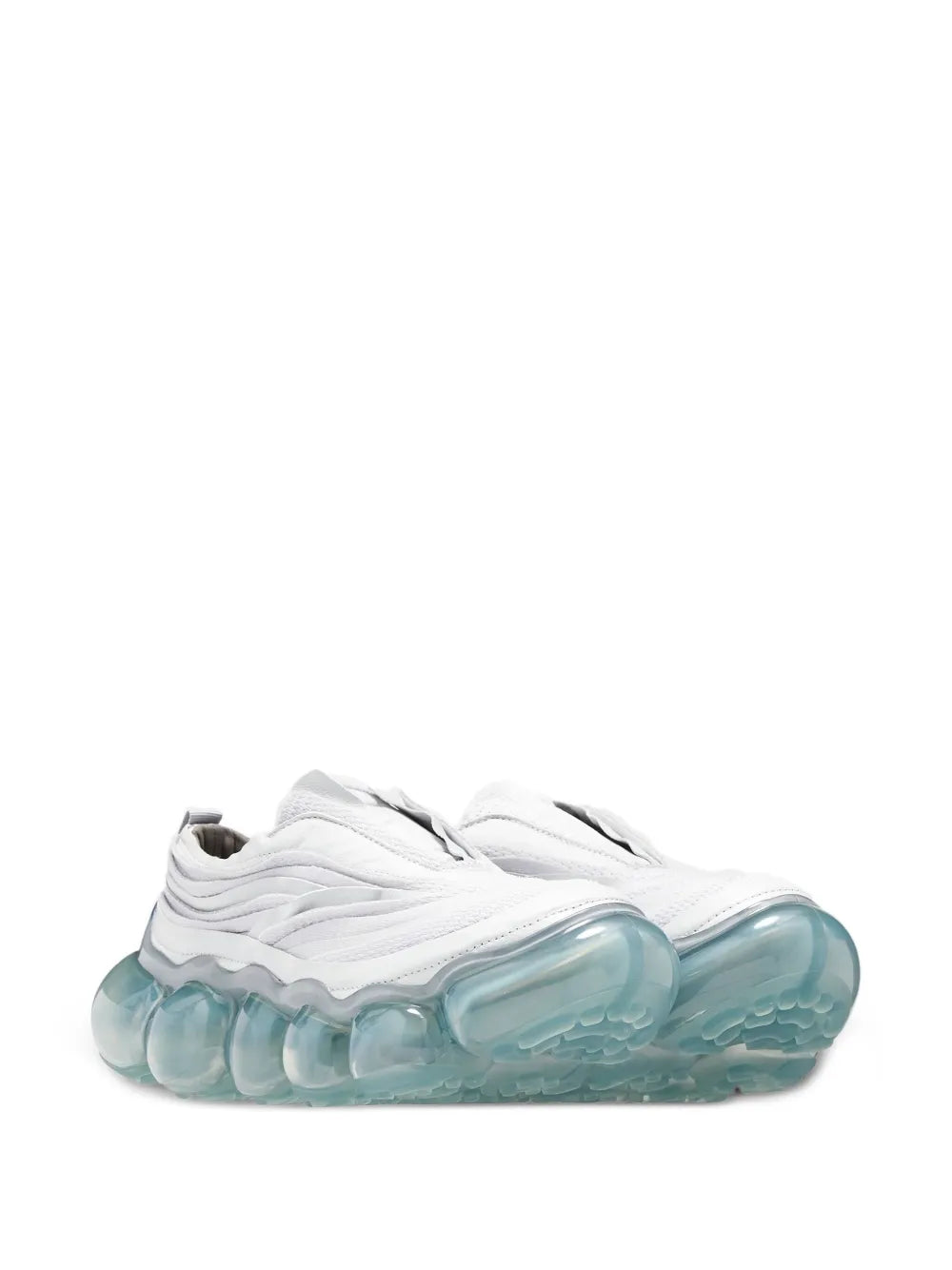 White slip-on sneakers with wavy upper and translucent teal bubble outsole
