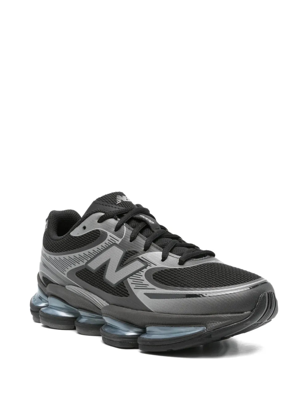 Black and gray lace-up sneakers with side N logo and blue-tinted shock pods