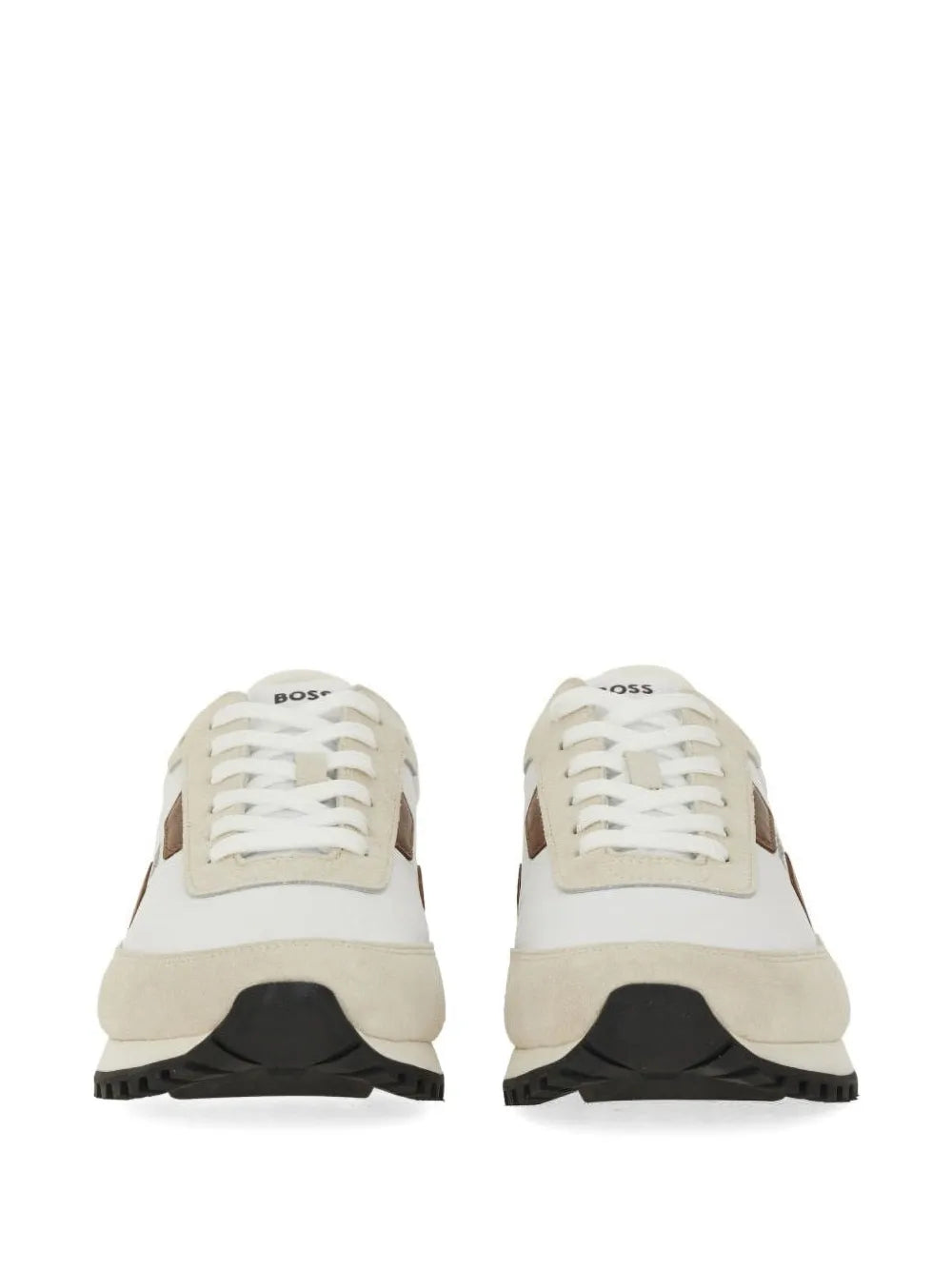 Beige panelled sneakers viewed from front with white laces and black tread sole