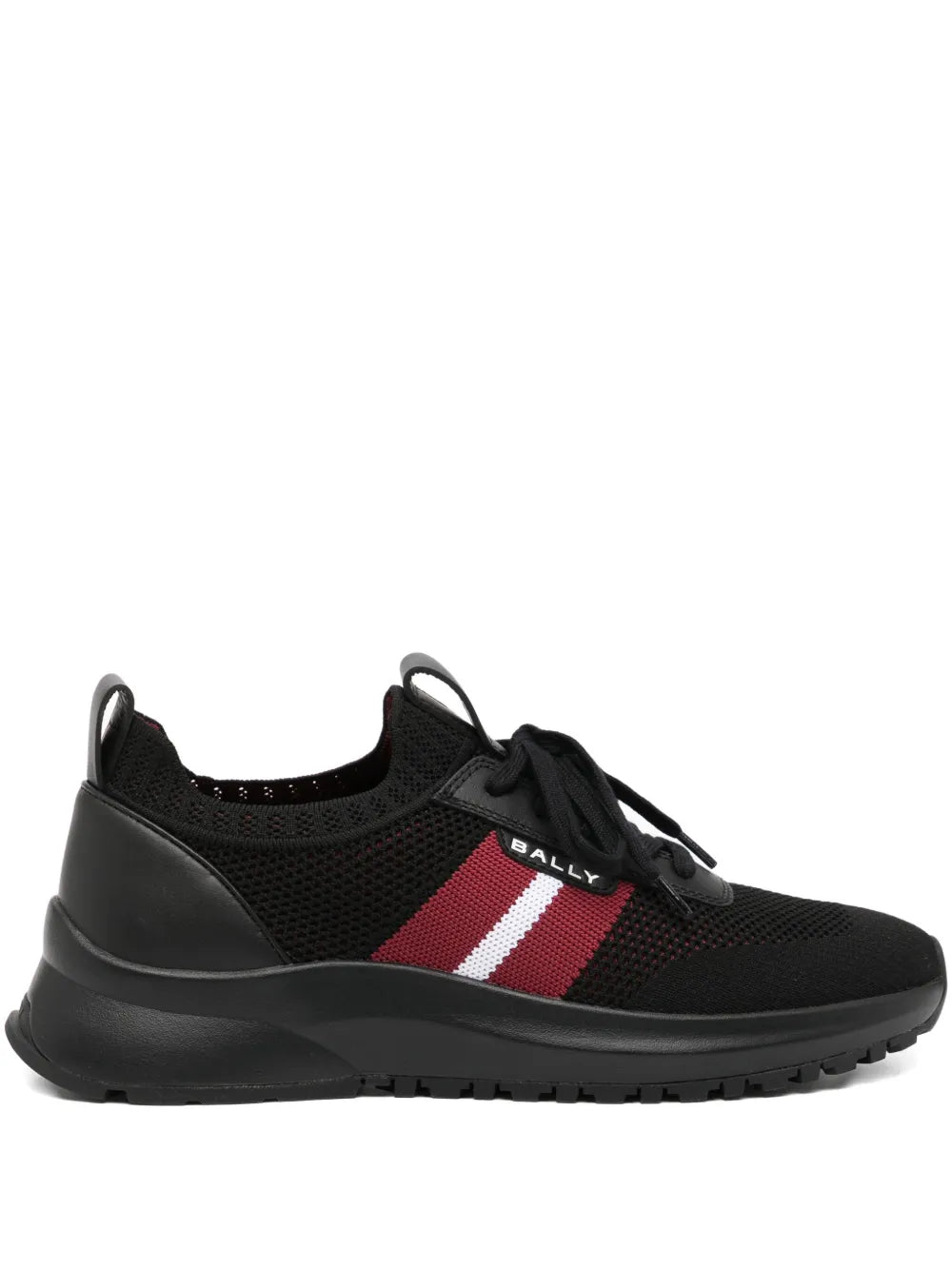 Black low-top trainers with red and white side stripe, black laces, rubber sole