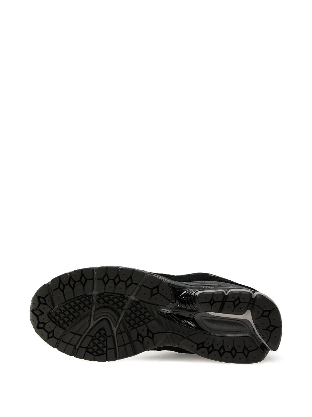 Black New Balance 2002R suede trainers, outsole tread and molded traction pods