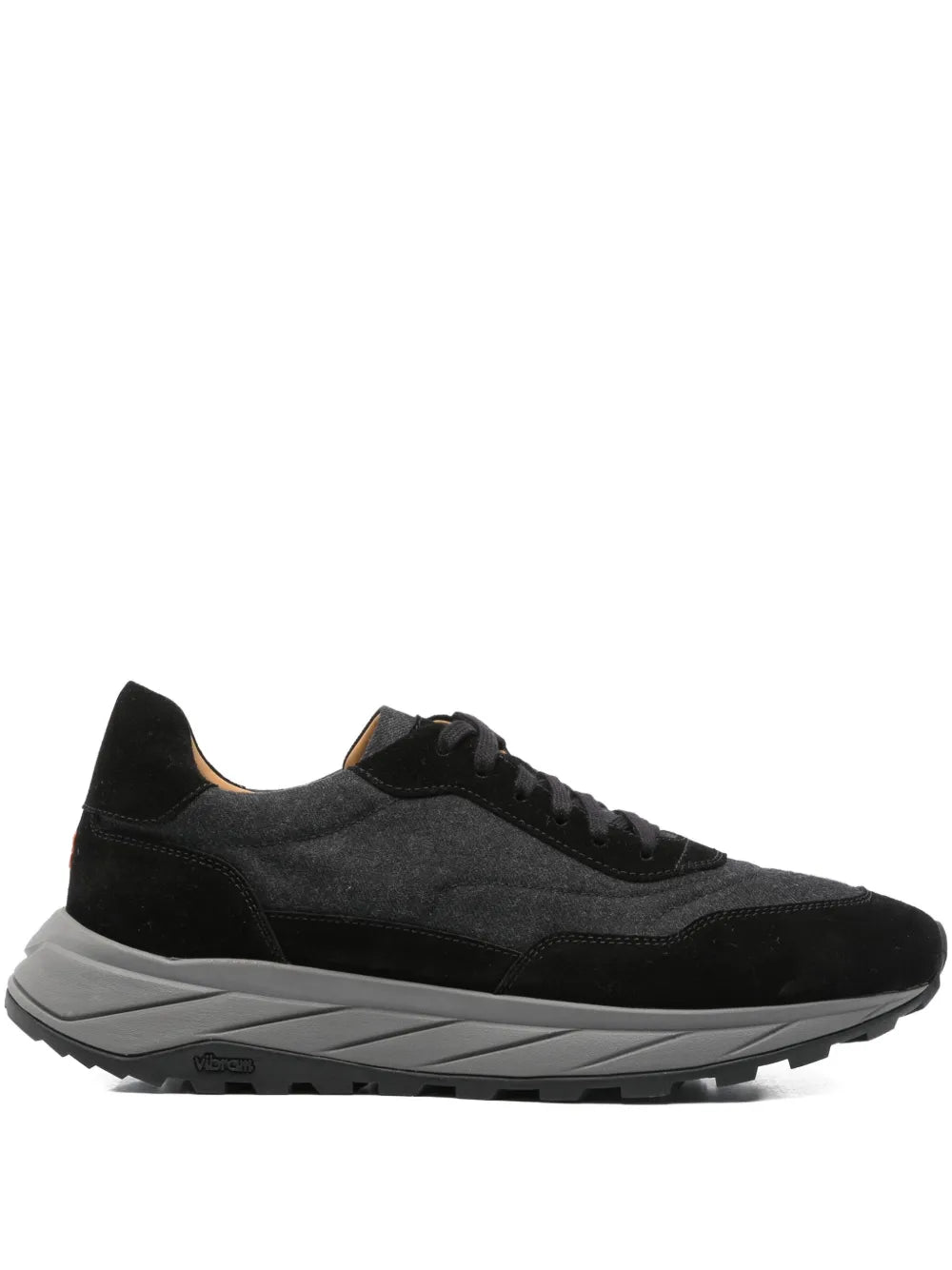 Black lace-up low-top sneakers with chunky gray rubber sole