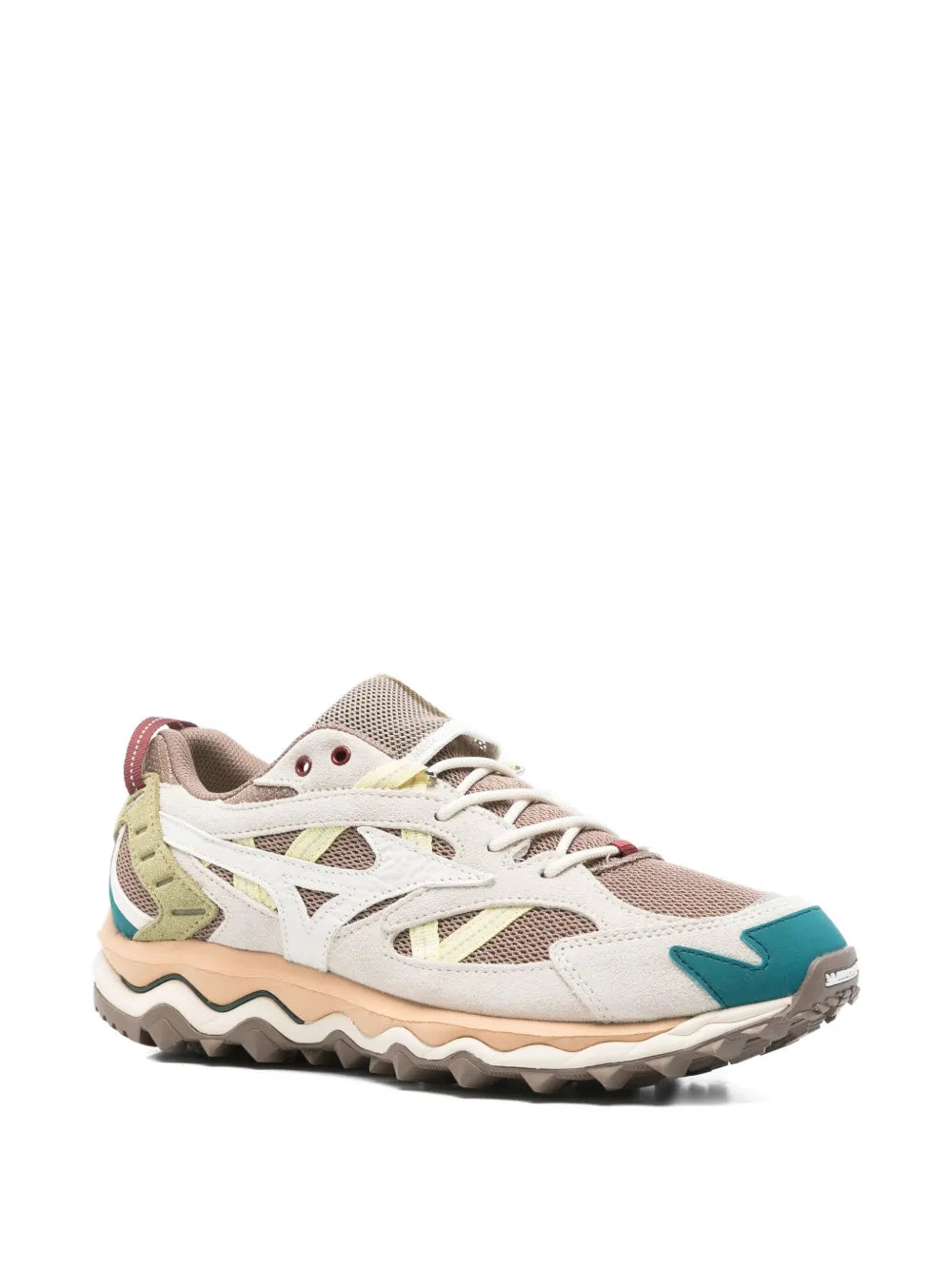 Grey low-top lace-up sneakers with teal toe accent, green overlays, and rugged sole