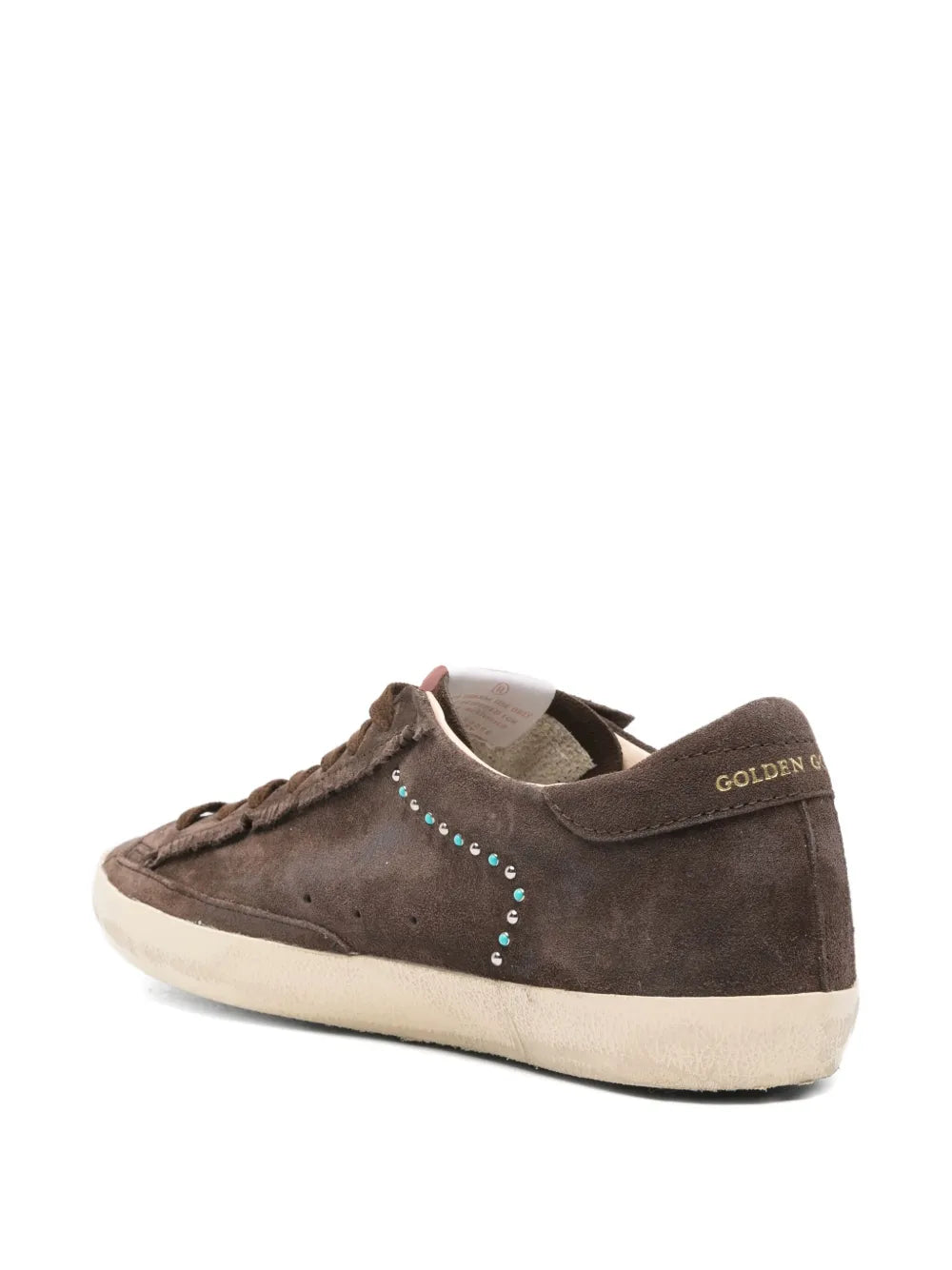 Dark brown suede sneakers with heel pull tab and multicolor stud star detail