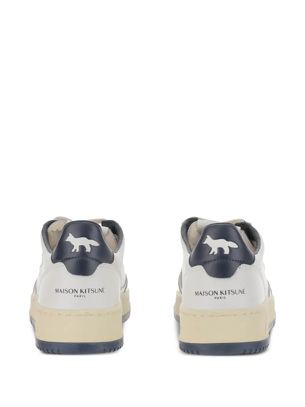 Pair of white low-top sneakers with navy heel tab and tan outsole, back view