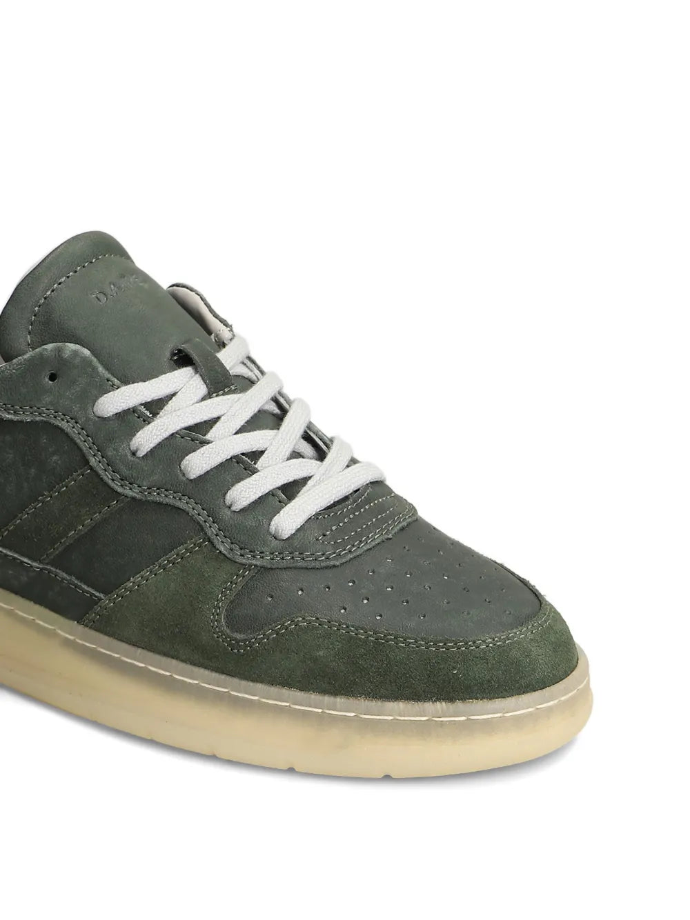 Green suede leather sneaker close-up, white laces and textured suede panels
