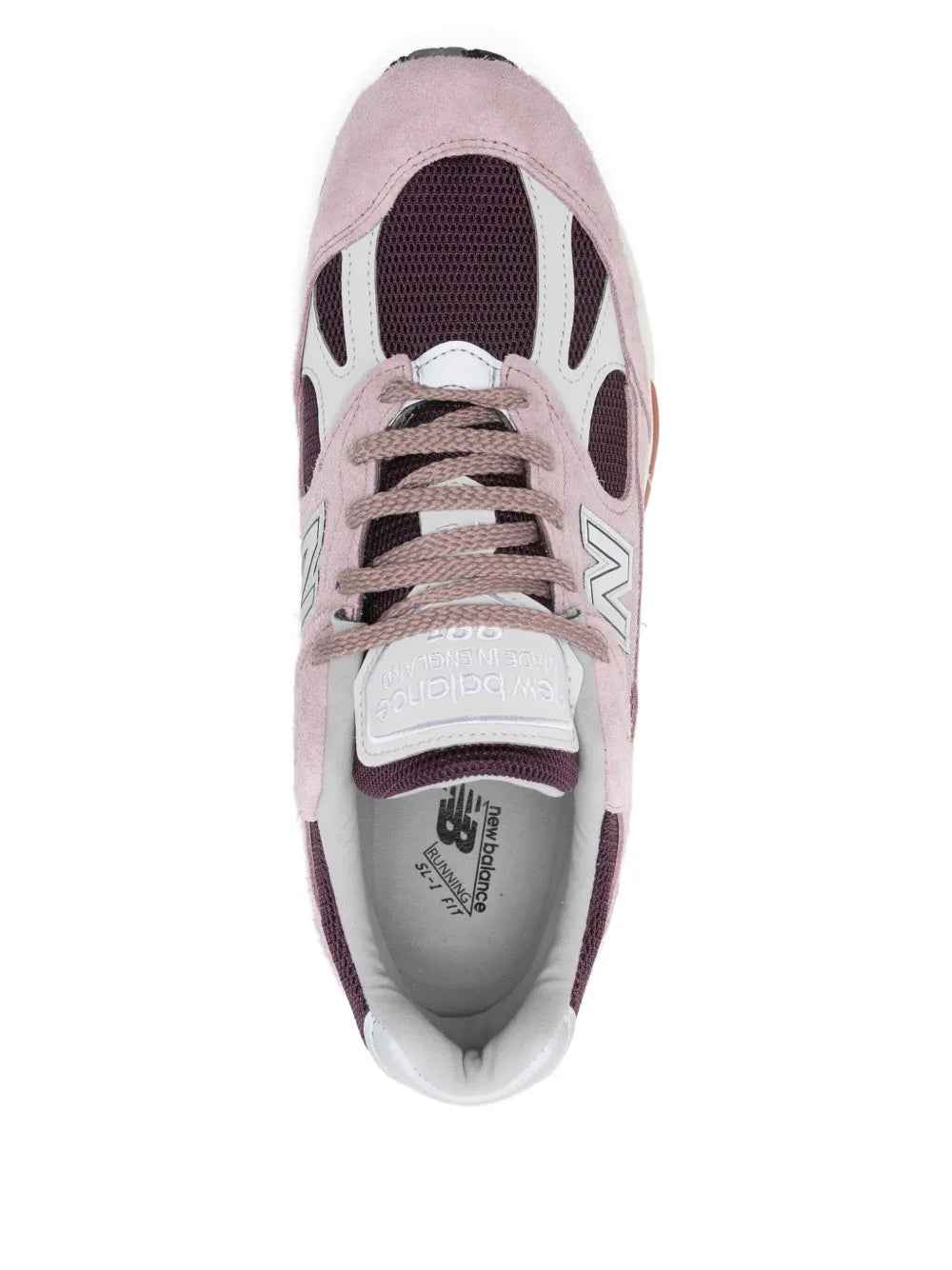 Pink suede New Balance 991 sneakers with lace-up front, mesh lining and padded collar