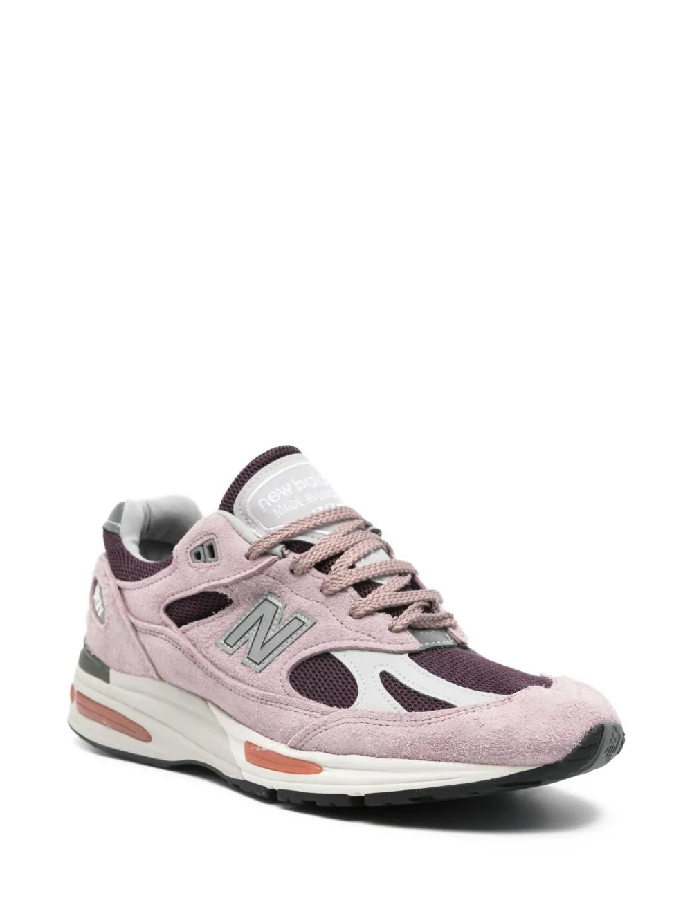 Pink suede lace-up New Balance 991 sneakers with N logo and orange outsole detail
