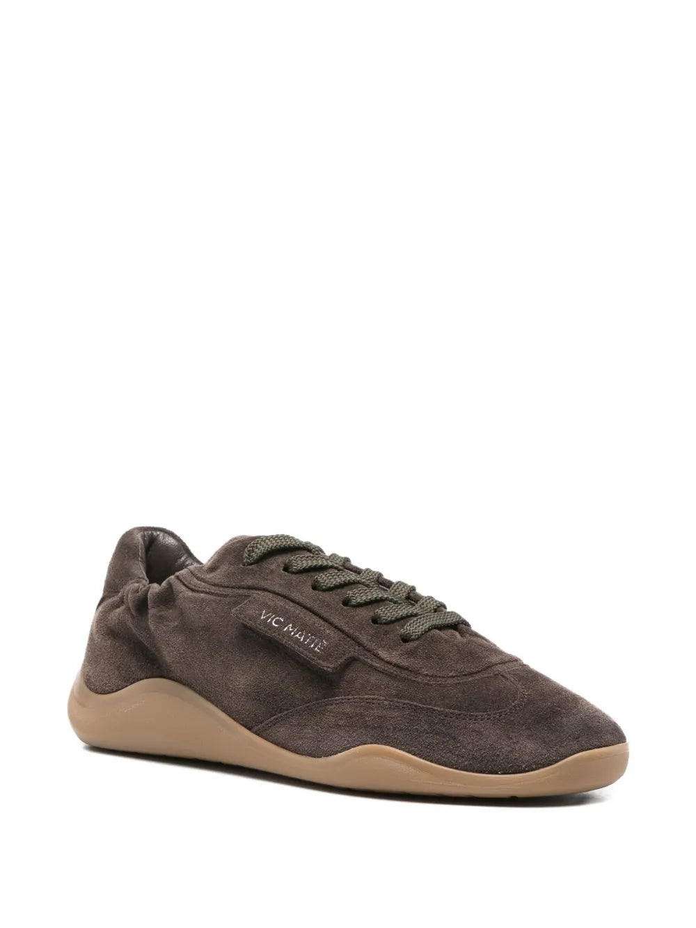 Dark brown suede lace-up trainer side view with tonal laces and logo patch