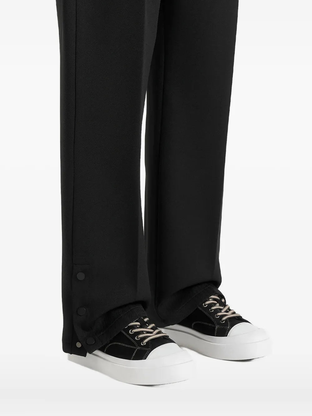Black suede sneakers with white platform sole and contrast stitching