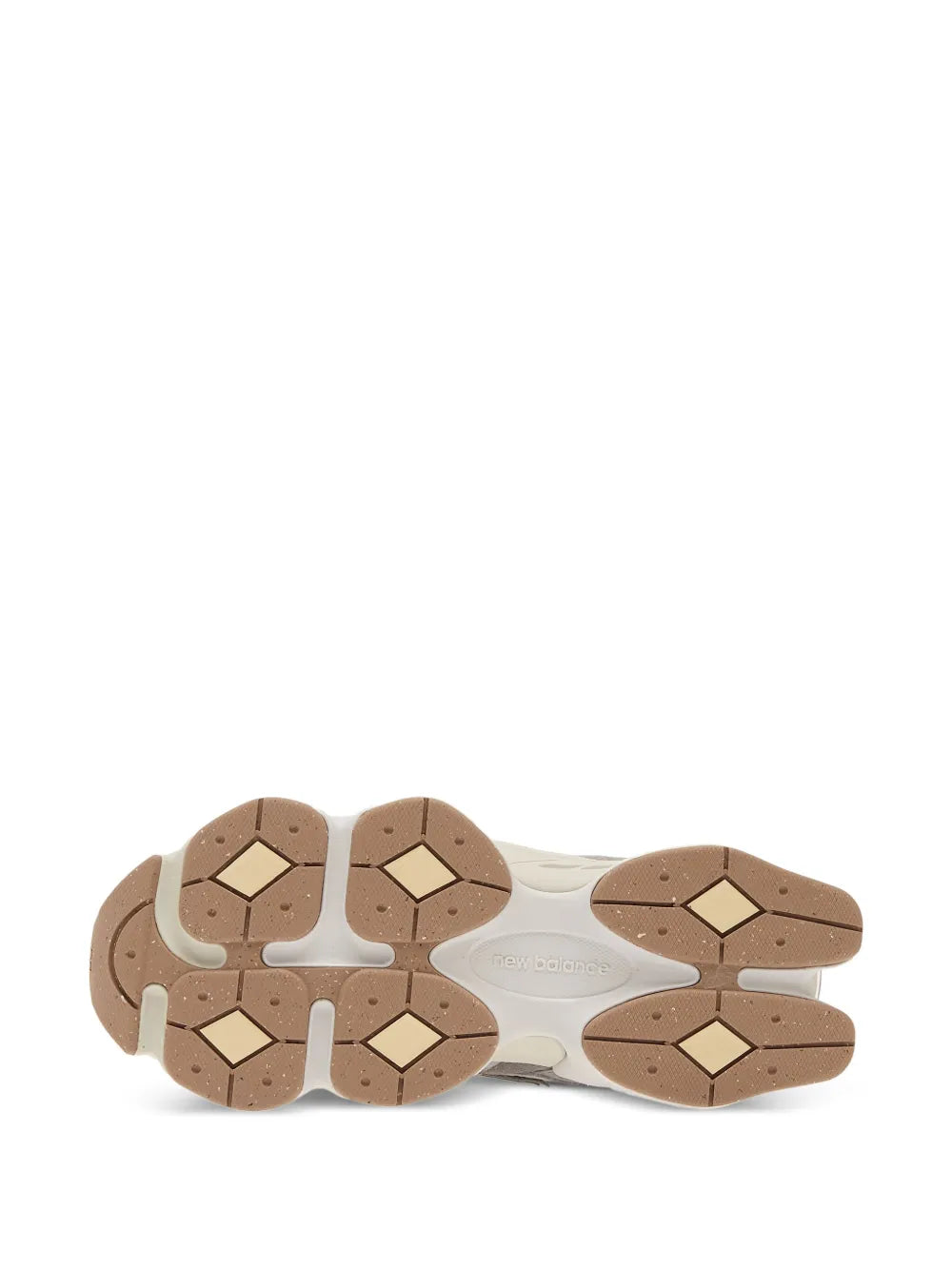 New Balance 9060 outsole view with brown tread blocks on a thick midsole