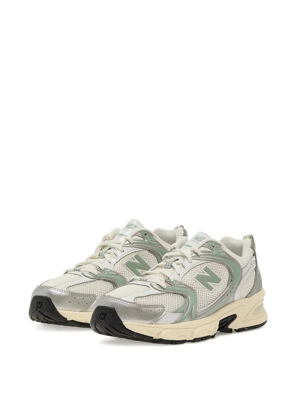 New Balance 530 mesh sneakers, angled view, grey-mint uppers with N logos and cream sole