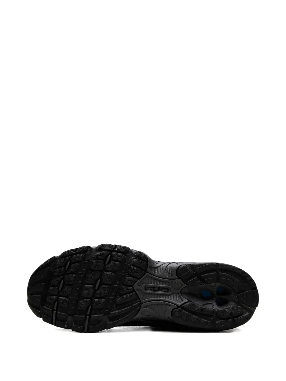 Black New Balance 509 outsole view with tread pattern and center logo