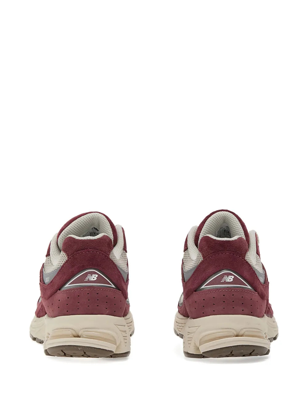 Back view of red suede New Balance 2002R sneakers with heel AB logo