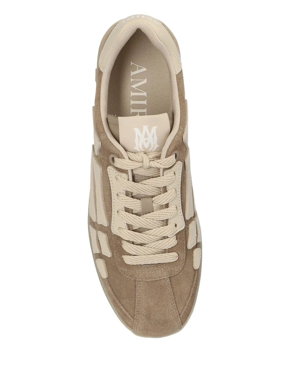 Light brown suede sneakers with white lace pattern and Amiri logo on tongue