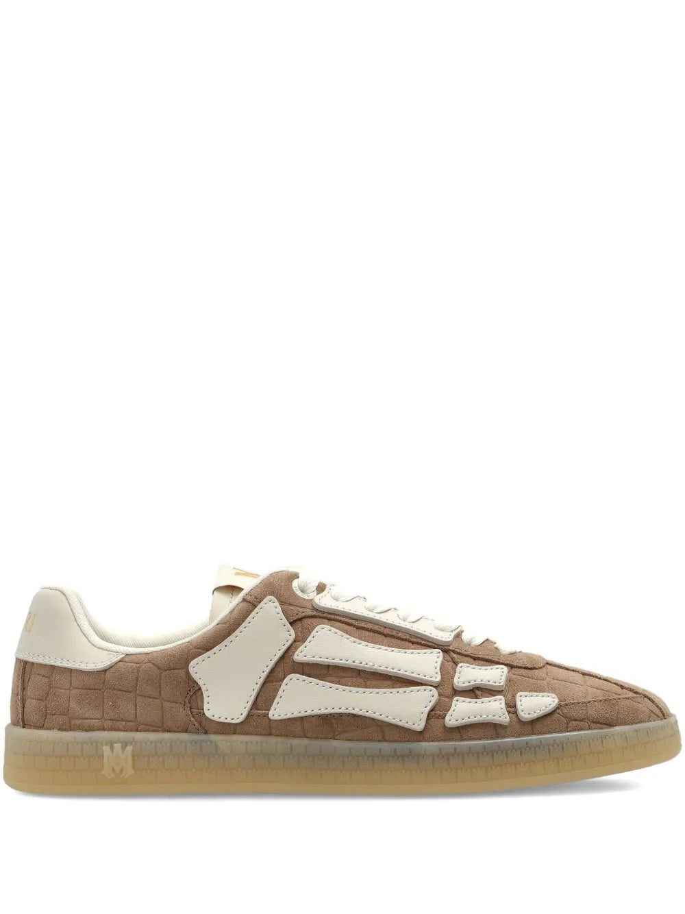 Light brown Amiri low-top trainers with white skeleton trim and lace-up front