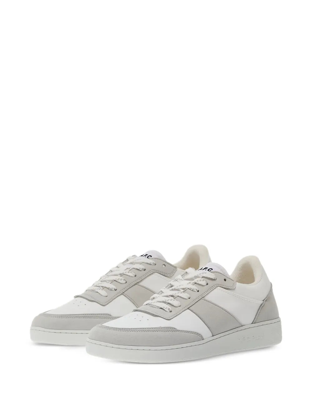 Pair of white low-top sneakers with gray side panels and off-white lining