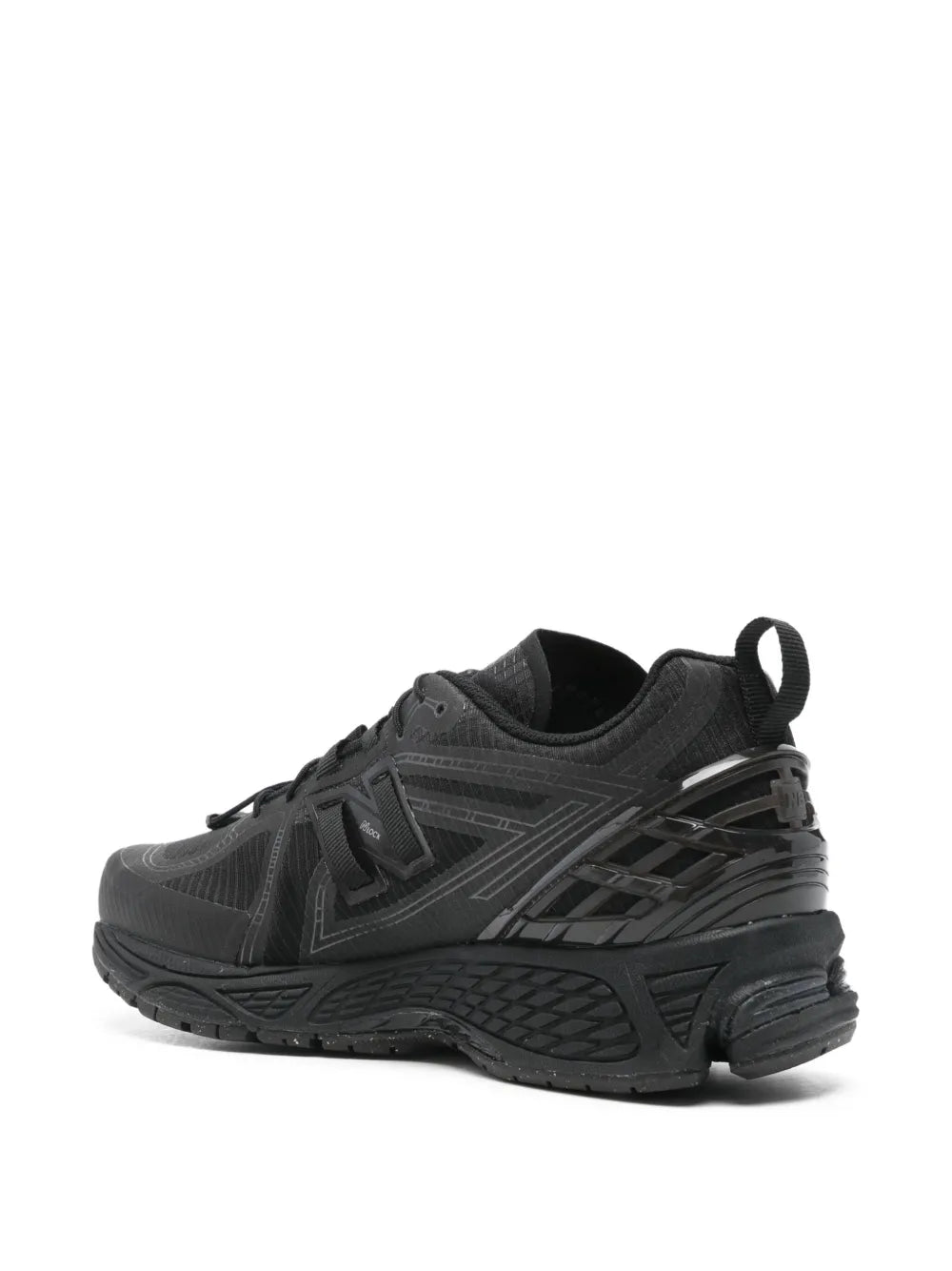 New Balance U1906 black lace-up sneakers, side view with textured mesh upper