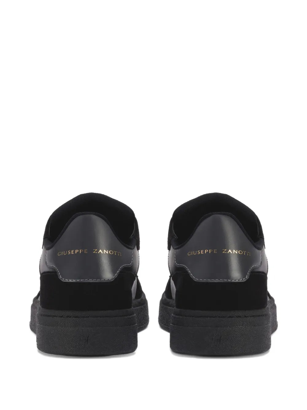 Black leather sneakers back view with brand text on heel lining
