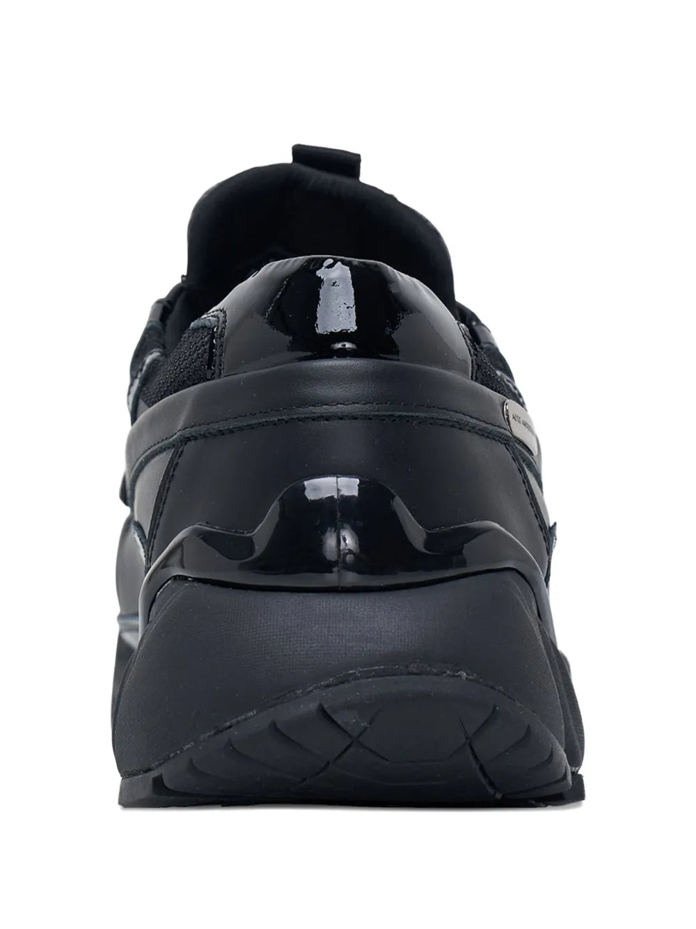 Black low-top sneakers from back with glossy toe cap and padded heel