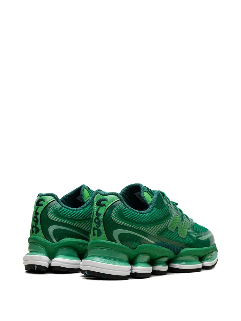 Green low-top lace-up sneakers, heel and back view with N logo