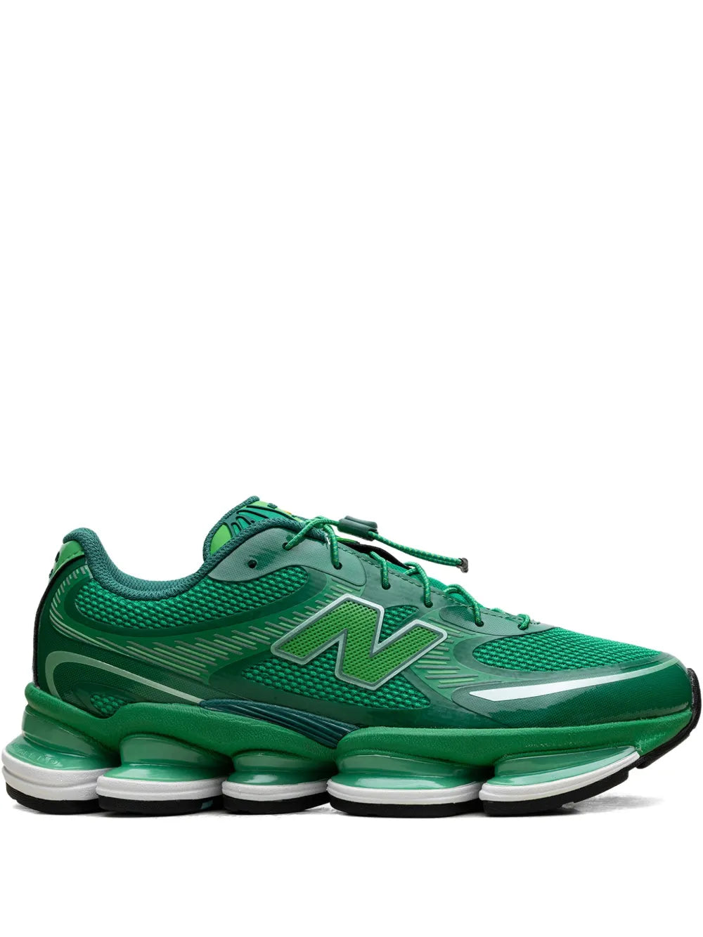 Green low-top lace-up sneakers with large N logo and white midsole