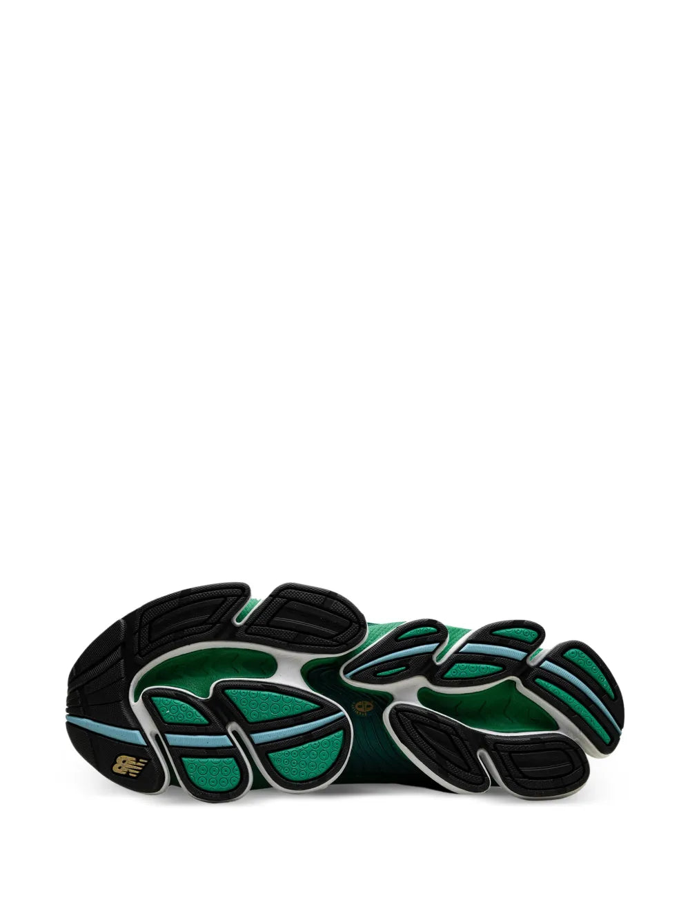 Green and black sneaker outsoles with tread and N logo accents