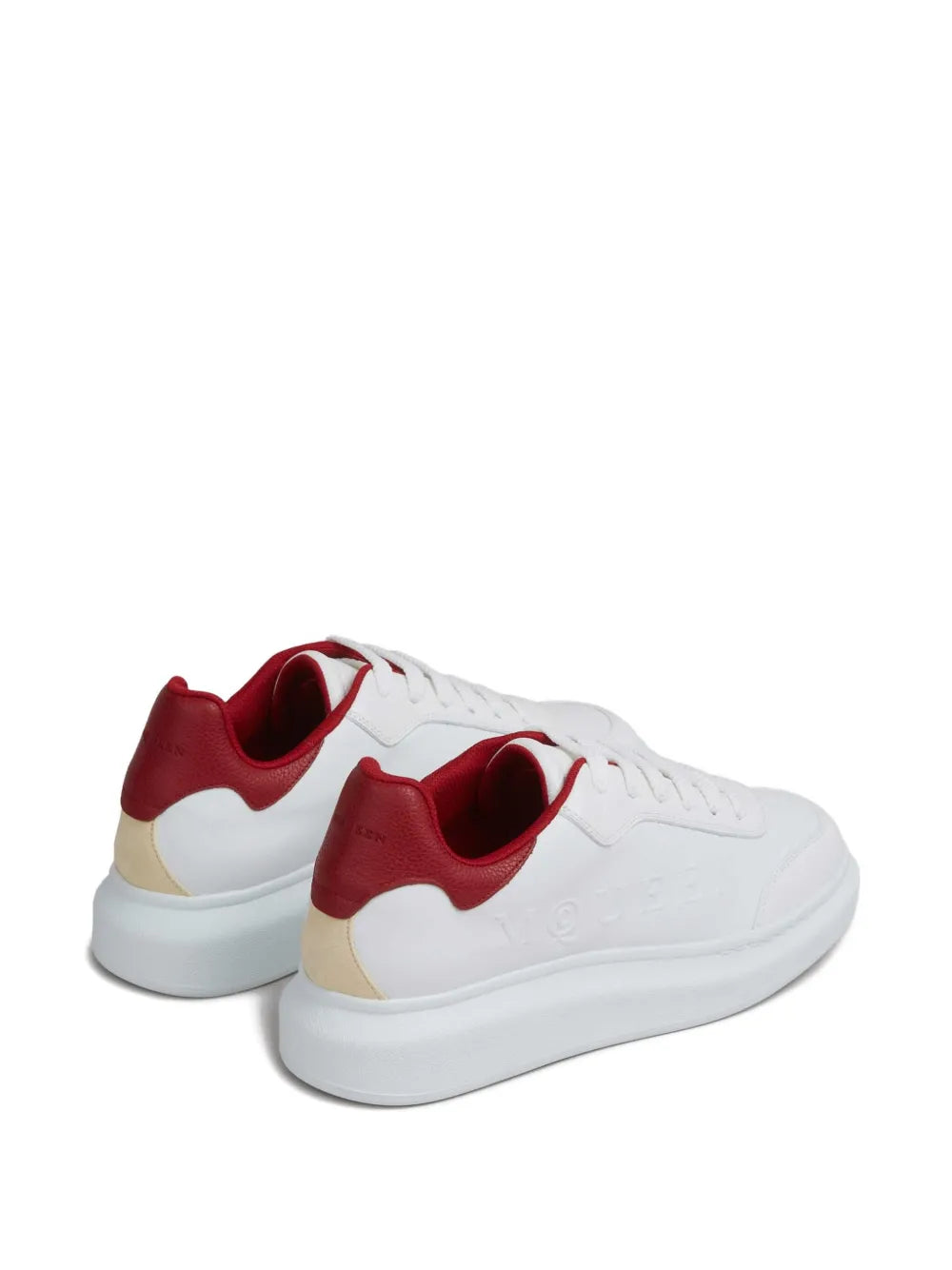 White and red trainers with rear red heel panel and beige midsole detail