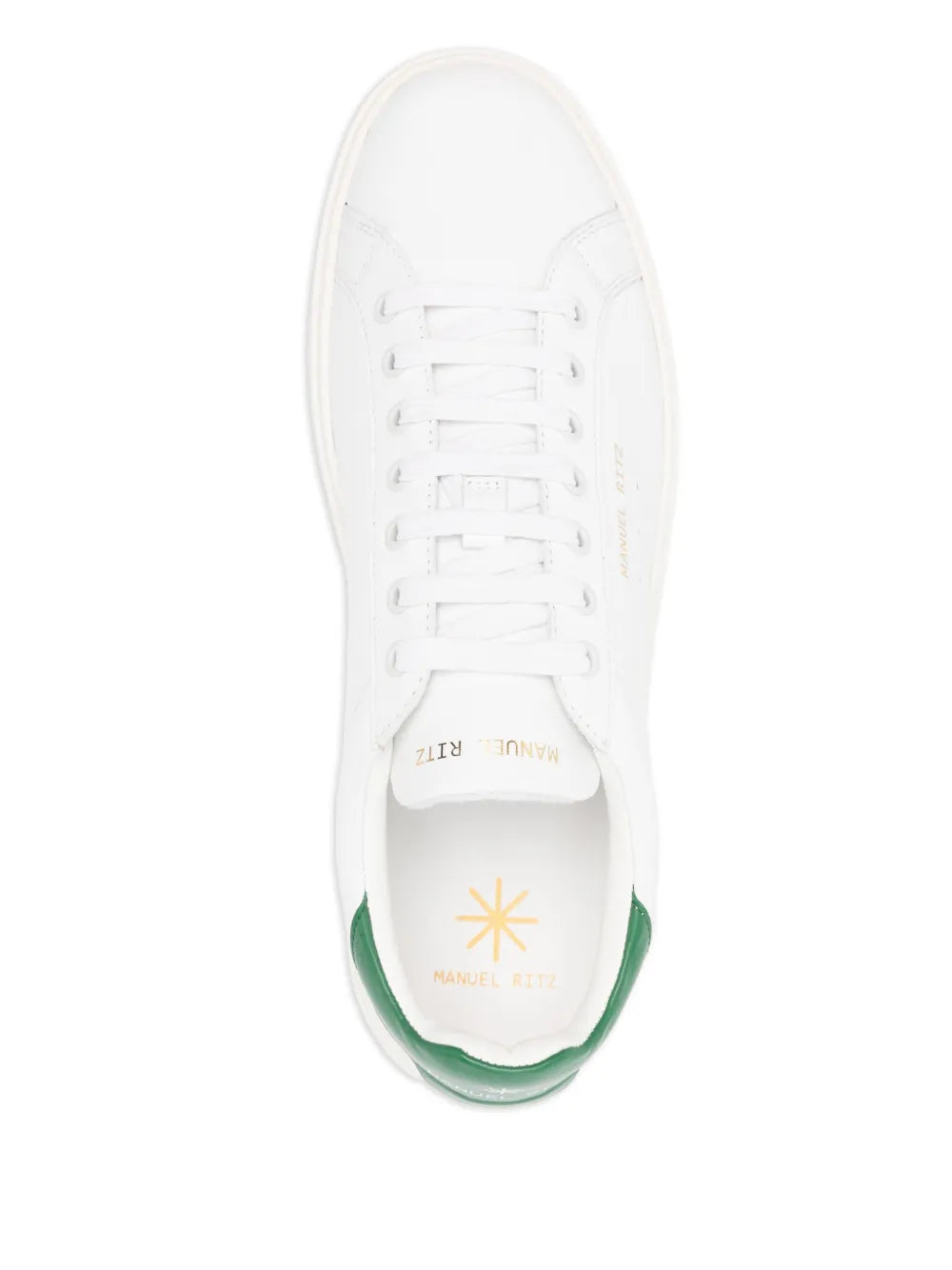 White leather sneaker with white laces, green-lined inner collar, side logo