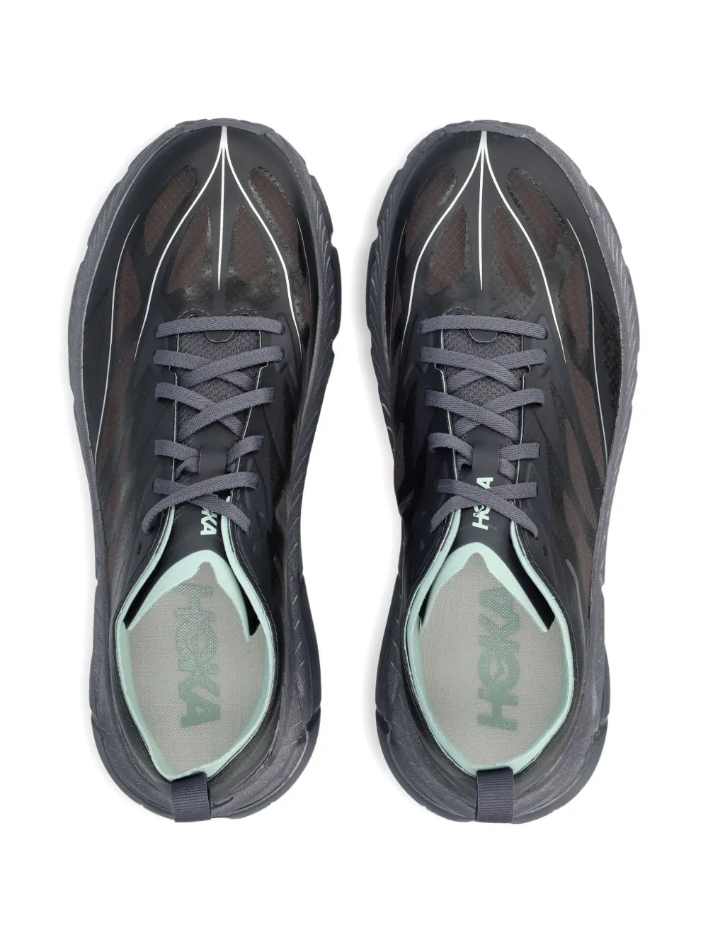 Charcoal sneakers with gray laces and 'HOKA' logo insoles