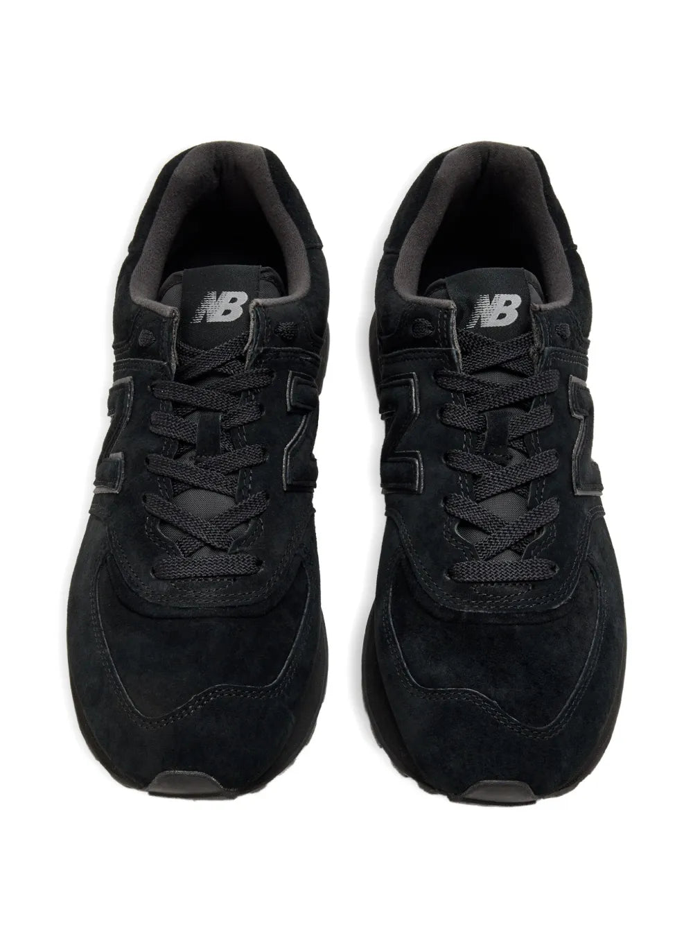 Pair of black New Balance 574 sneakers, lace-up with NB logo on tongue