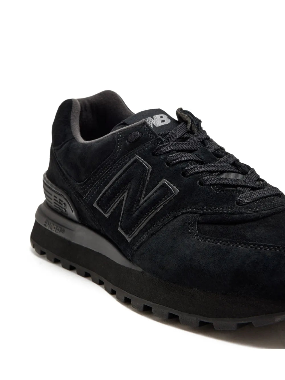 Black New Balance 574 sneakers with chunky tread sole and side N logo