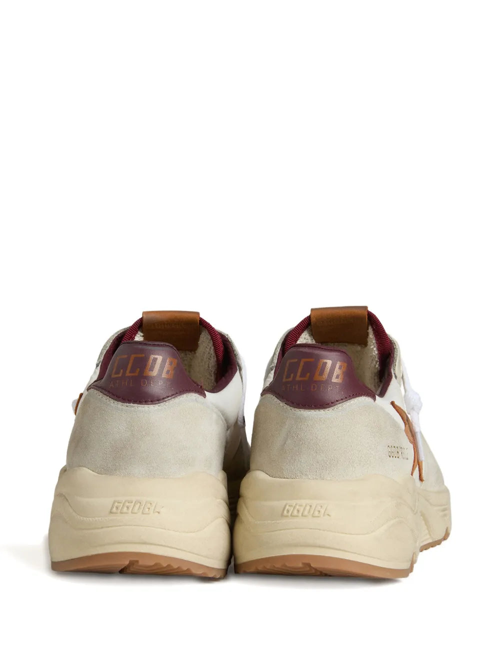 Back view of white sneakers with tan sole and maroon heel logo print