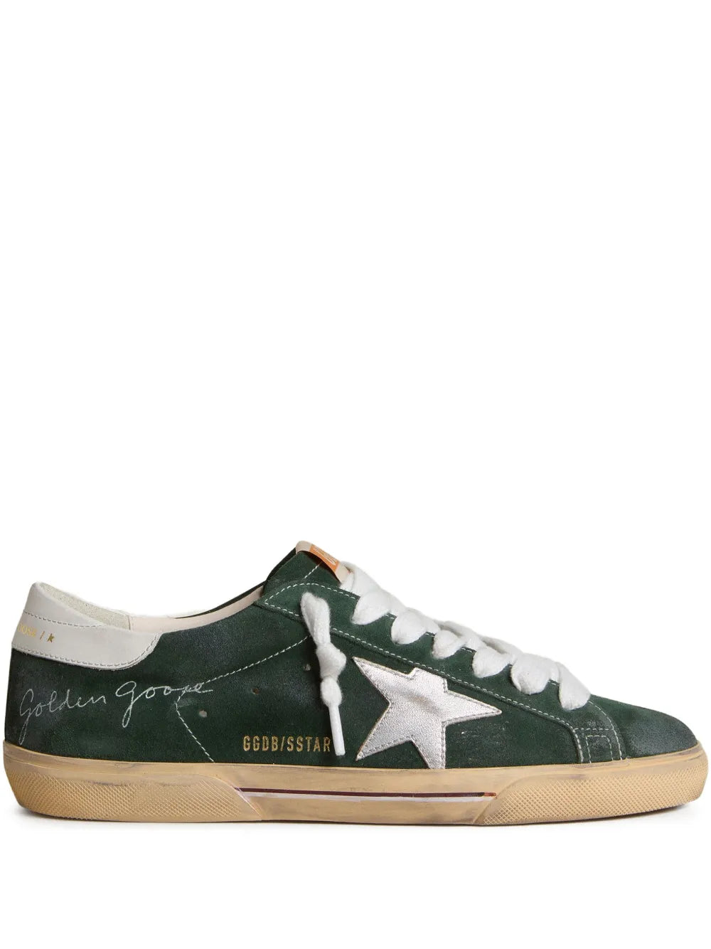 Green leather low-top sneakers with white laces and silver star logo, gum sole
