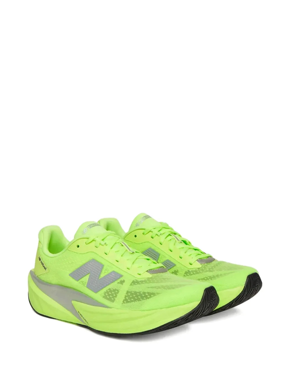 Lime green lace-up running sneakers with textured upper and black toe accents