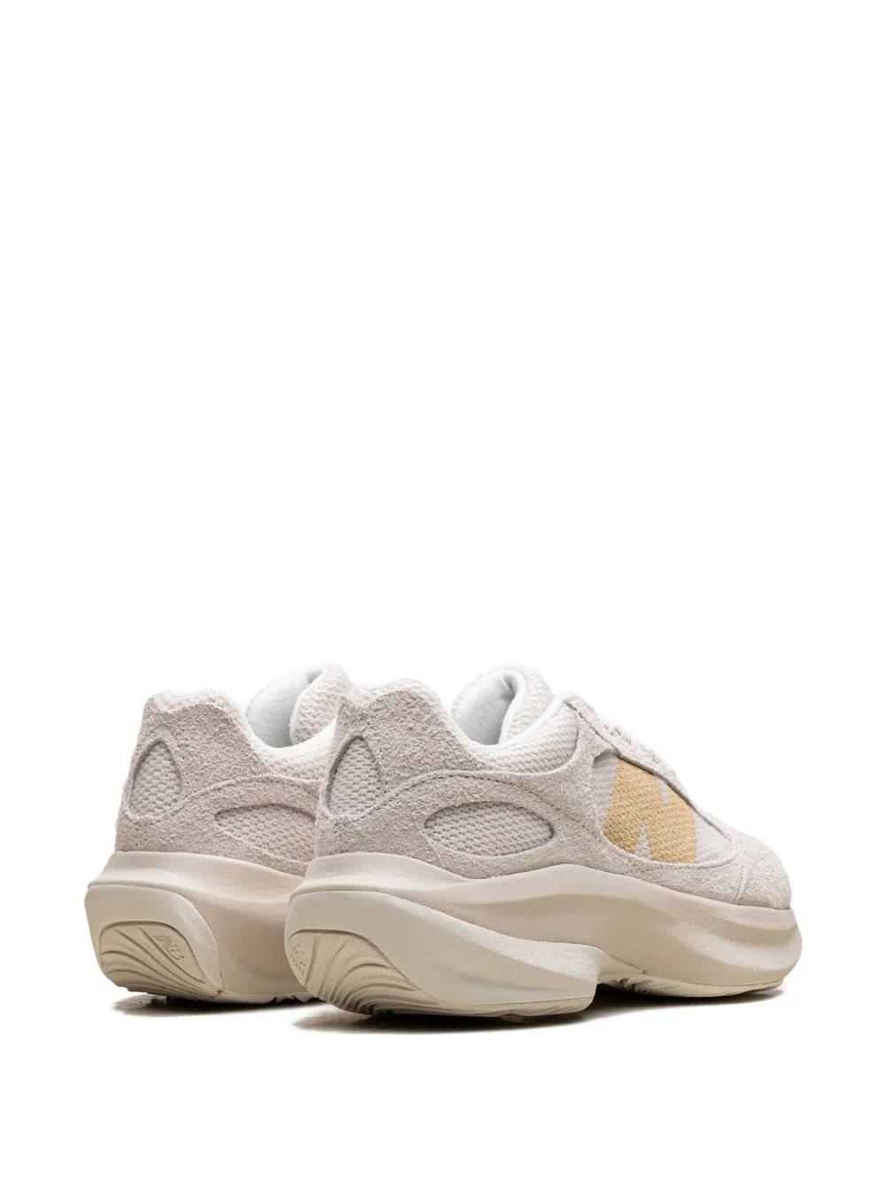 Beige New Balance WRPD Runner sneakers, angled rear view with cushioned midsole