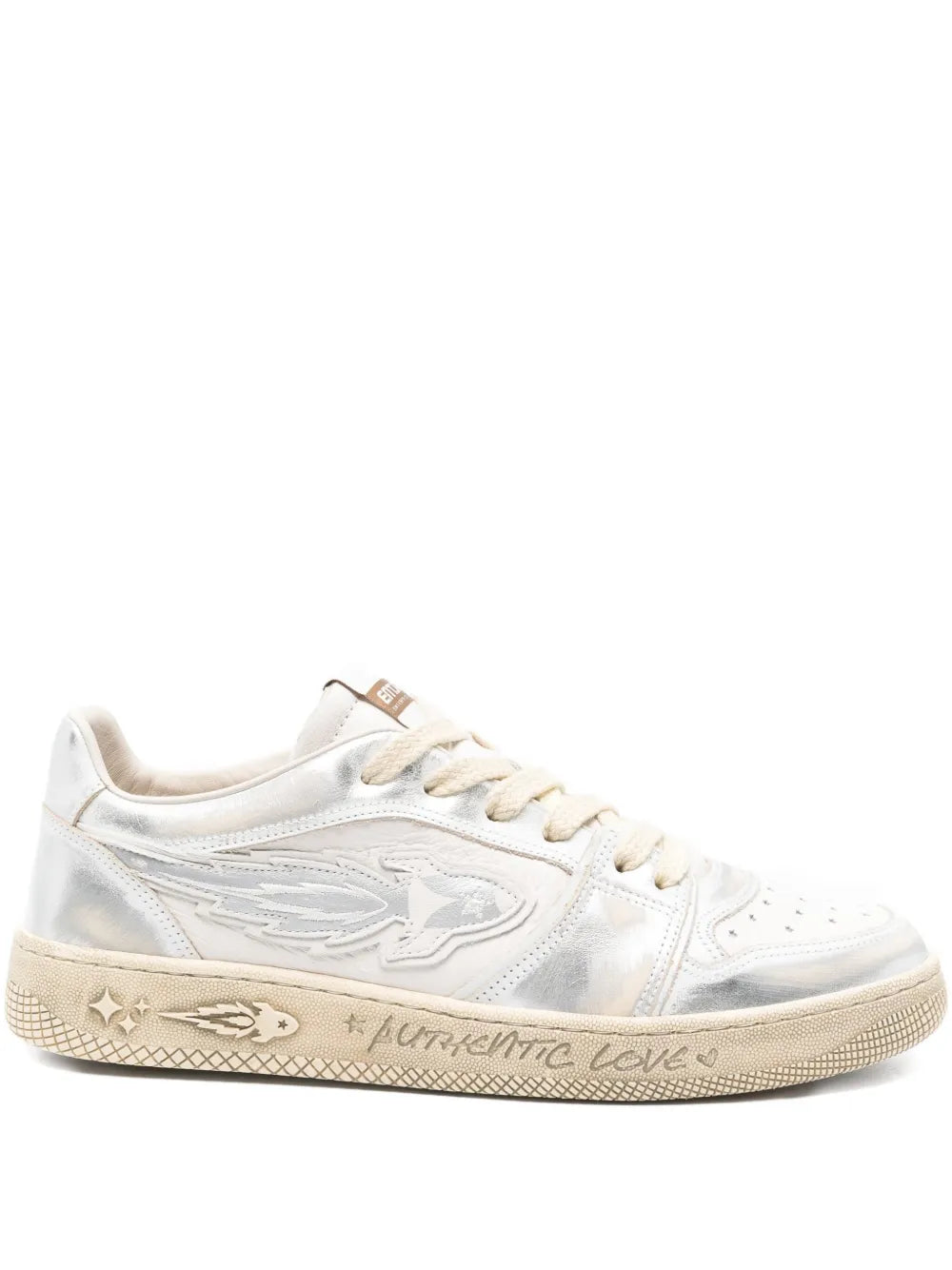 White lace-up sneakers with embossed side logo and beige textured sole trim