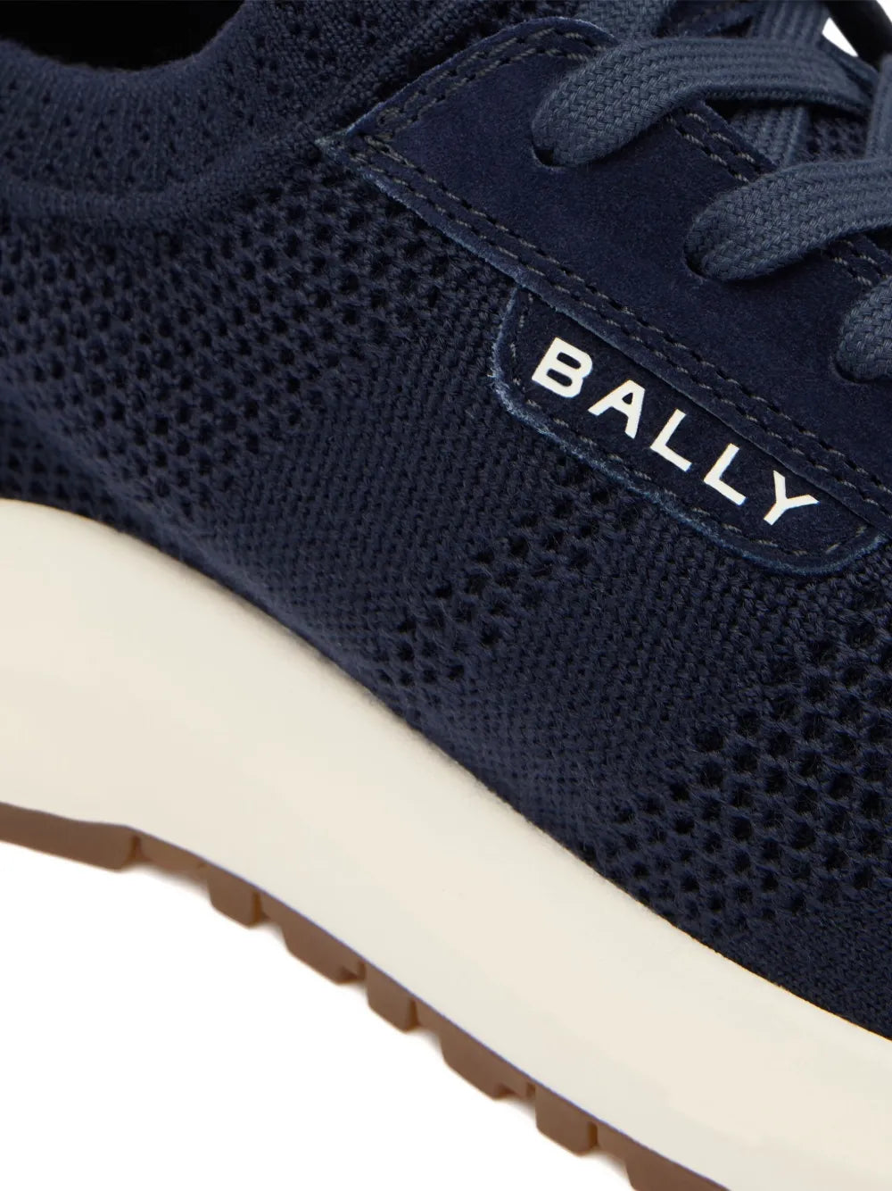 Bally outline sneakers close-up: navy mesh upper with stitched BALLY logo and cream sole