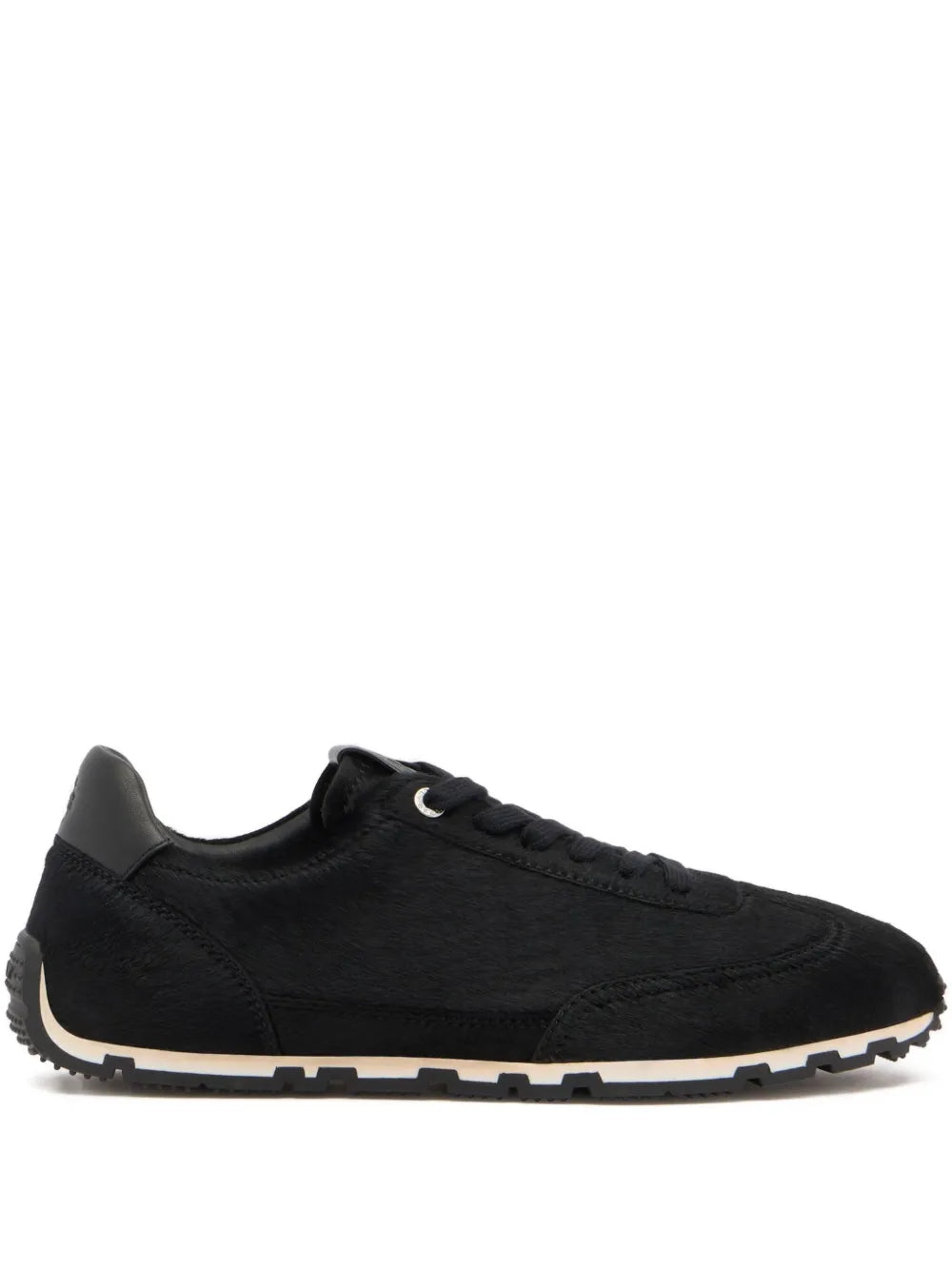 Black low-top suede sneakers with lace-up closure and chunky rubber sole