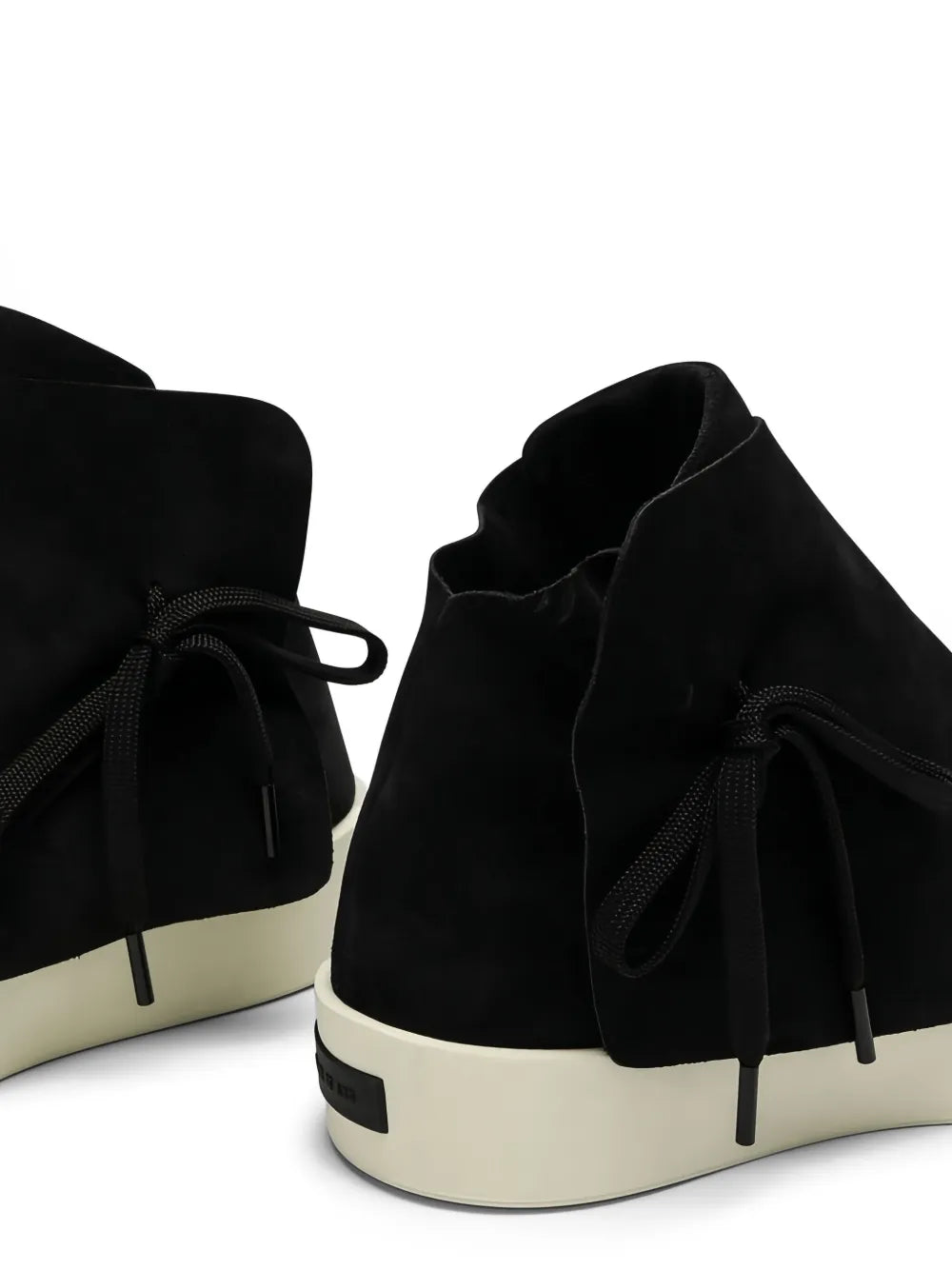 Black high-top lace-up sneakers showing lace tie and off-white platform sole
