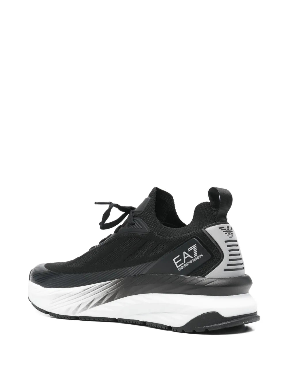 Black lace-up trainers with heel pull tab, EA7 side logo, and white midsole